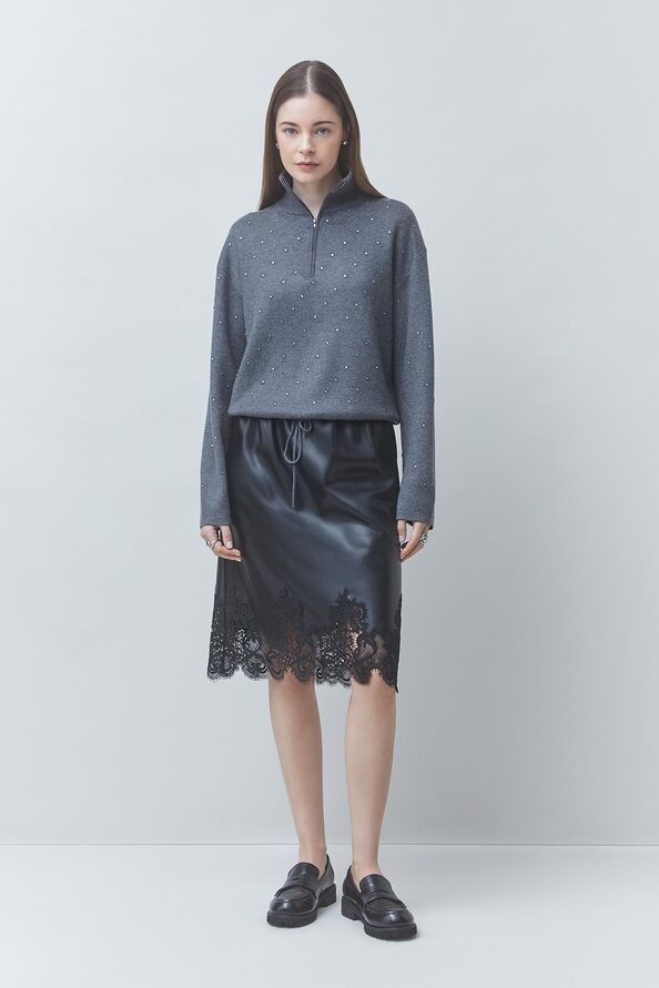 FLOW Black faux leather skirt with lace details